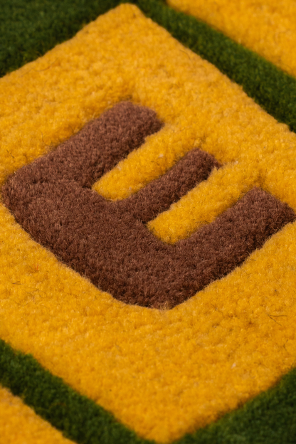 Weed Block Letter Tufted Rug – Green & Yellow Statement Text Rug